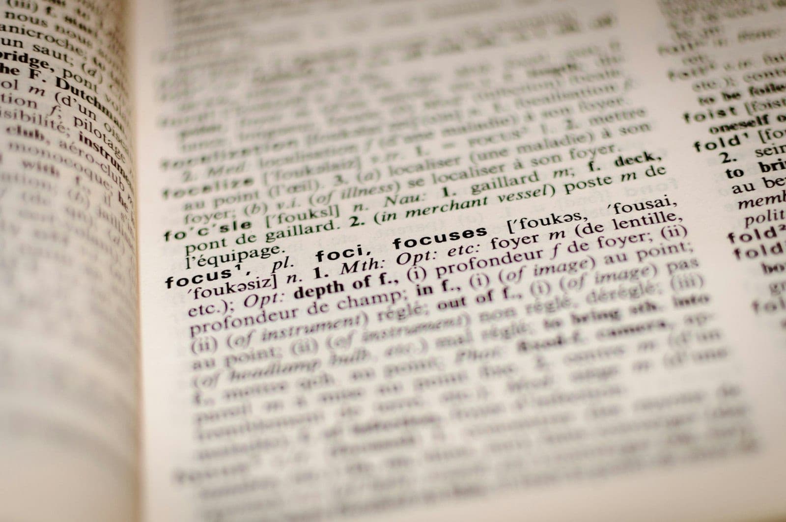 An open dictionary highlighting an English word